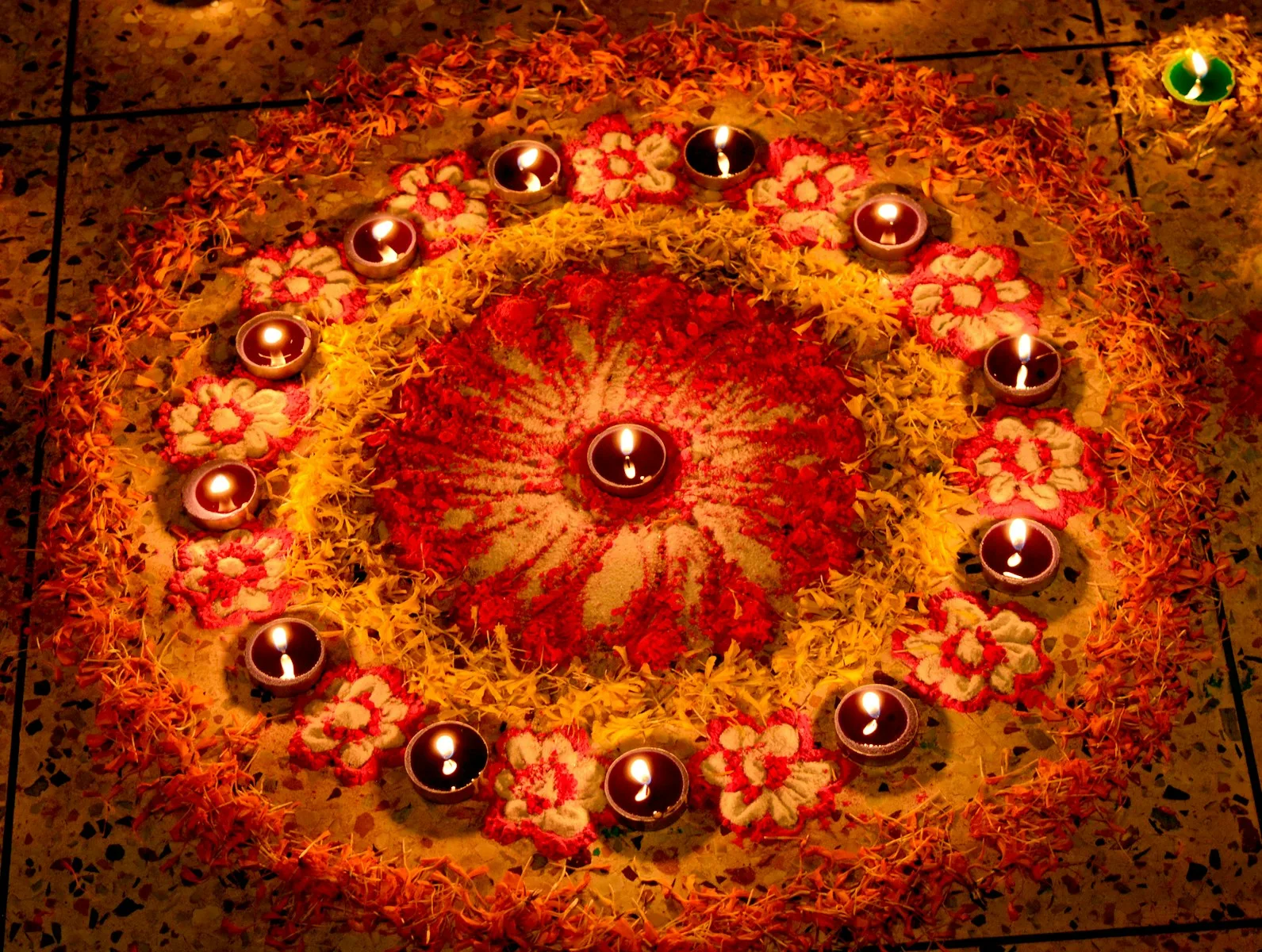 a circular arrangement of candles on a floor