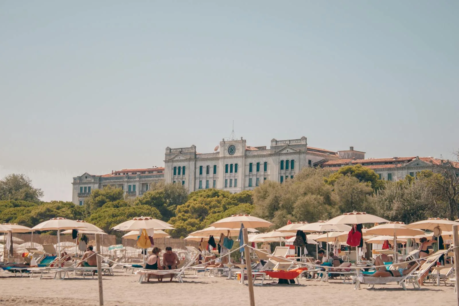 People on Beach with Grand Hotel des Bains in Venice