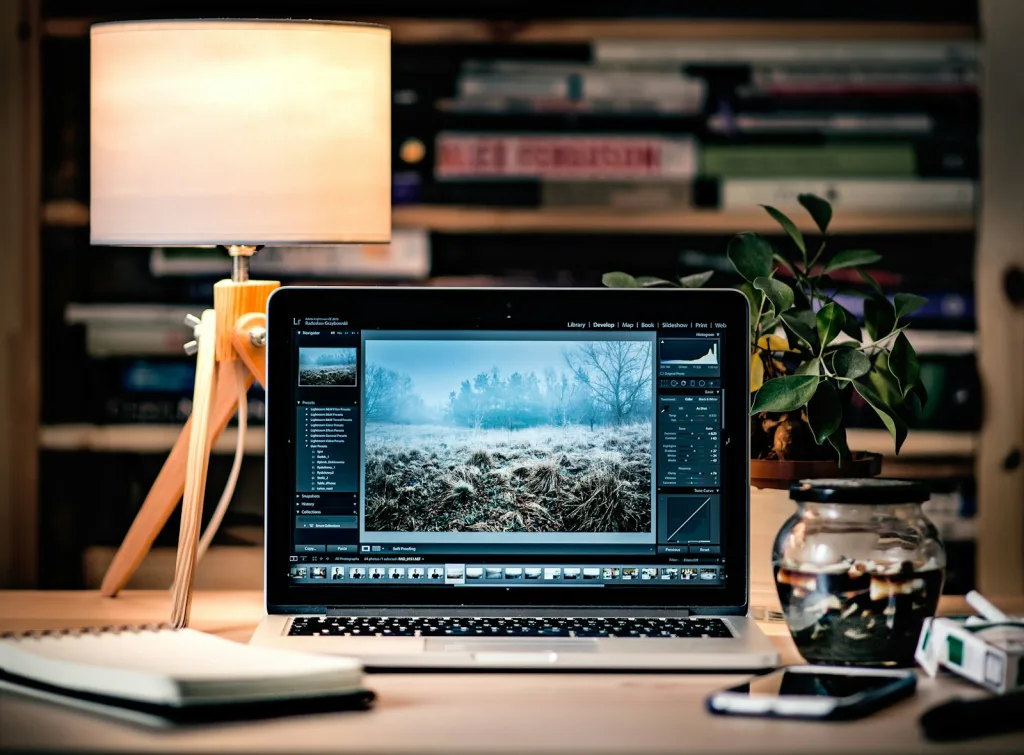 MacBook Pro on brown wooden table inside room