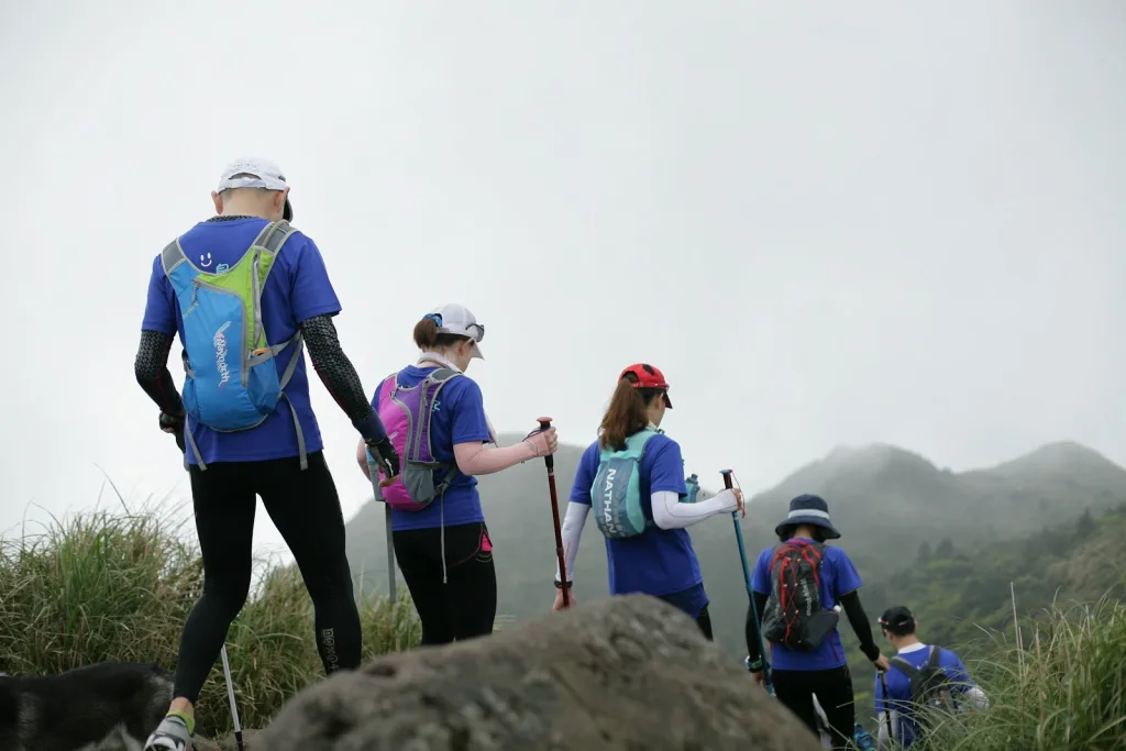 people standing on rock during daytime